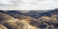 Aerial shot of Wadi Mujib in Jordan under the cloudy sky Royalty Free Stock Photo
