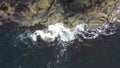 Aerial shot of waves crashing on Hamaroy, Norway