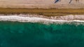 Aerial shot of waves crashing the shore in Almunecar, Spain, cool for background