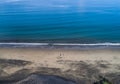 Aerial shot of wedding dress couple on the tropical beach Playa Arenillas in Costa Rica with a heart drawn into Sand Royalty Free Stock Photo