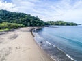 Aerial shot of wedding dress couple on the tropical beach Playa Arenillas in Costa Rica with a heart drawn into Sand Royalty Free Stock Photo