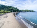 Aerial shot of wedding dress couple on the tropical beach Playa Arenillas in Costa Rica with a heart drawn into Sand Royalty Free Stock Photo