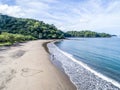 Aerial shot of wedding dress couple on the tropical beach Playa Arenillas in Costa Rica with a heart drawn into Sand Royalty Free Stock Photo