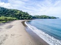 Aerial shot of wedding dress couple on the tropical beach Playa Arenillas in Costa Rica with a heart drawn into Sand Royalty Free Stock Photo