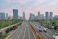 Aerial shot of a wide street in Shanghai full of cars with high skyscrapers on the background Royalty Free Stock Photo