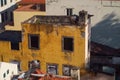 Aerial shot of a yellow abandoned building on a sunny day