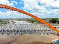 Aerial Side View of A Bridge Hovering Upon A River