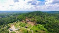 Aerial Side View Of A Farmland Surrounded by Forest in the Day