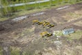 Aerial side view of four yellow crawler excavators standing on ground near the construction site and waiting for the working day Royalty Free Stock Photo