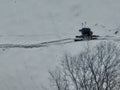 Aerial Ski touring man crossing over the camera view in the mountains in winter season fresh snow. Ski touring on skin Royalty Free Stock Photo