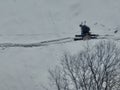 Aerial Ski touring man crossing over the camera view in the mountains in winter season fresh snow. Ski touring on skin Royalty Free Stock Photo