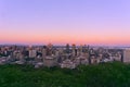 An aerial skyline view of a city skyscrapers, buildings, and streets taken from a mountain at sunset, Montreal, QC, Canada Royalty Free Stock Photo