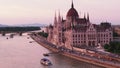 Aerial slide and pan footage of Orszaghaz on Danube riverbank at twilight. Famous travel destination and tourist sight