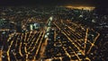 Aerial slow motion cityscape at night. Illuminated streets of Manila downtown at traffic city route Royalty Free Stock Photo