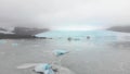 Aerial slow motion panning view Fjallsjokull glacier. The wonderful glacier lagoon of FjallsÃÂ¡rlÃÂ³n in Iceland