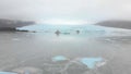 Aerial slow motion rising view Fjallsjokull glacier. The wonderful glacier lagoon of FjallsÃÂ¡rlÃÂ³n in Iceland