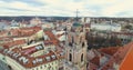 AERIAL. Smooth 360 orbit flight around beautiful Church of All Saints (Visu Sventuju) in Vilnius old town, Lithuania. Panorama of