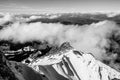 Aerial snowy mountains view on sunny day with clouds. Black and white landscape with lights and shadows in mount Pilatus, Lucern. Royalty Free Stock Photo