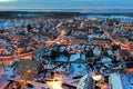 Aerial from a snowy village Huizen in winter in the Netherlands at twilight Royalty Free Stock Photo