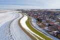 Aerial from snowy village Moddergat in Friesland at a frozen Waddensea in the Netherlands