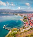 Aerial spring cityscape of Pogradec town. Colorful morning scene of Ohrid lake. Royalty Free Stock Photo