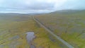 AERIAL: Straight road runs across the rugged terrain in mainland Faroe Islands.