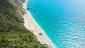 AERIAL: Stunning view from above of a remote white sand beach and turquoise sea. Royalty Free Stock Photo