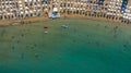 AERIAL. Summer beach with people and turquoise ocean water from top point of view, Royalty Free Stock Photo