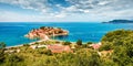 Aerial summer cityscape of Sveti Stefan town. Panoramic morning seascape of Adriatic sea, Montenegro, Europe. Beautiful world of M Royalty Free Stock Photo