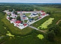 Aerial summer view of white old monastery with golden domes among green fields in Rostov the Great city. Russia Royalty Free Stock Photo