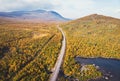 Aerial sunny fall autumn view of Abisko National Park, Kiruna Municipality, Lapland, Norrbotten County, Sweden, shot from drone,