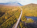 Aerial sunny fall autumn view of Abisko National Park, Kiruna Municipality, Lapland, Norrbotten County, Sweden, shot from drone, Royalty Free Stock Photo