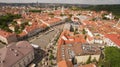 AERIAL. Sunny summer shot above Town Hall Square of Vilnius old