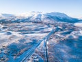 Aerial sunny winter view of Abisko National Park, Kiruna Municipality, Lapland, Norrbotten County, Sweden, shot from drone, with r