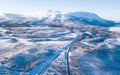 Aerial sunny winter view of Abisko National Park, Kiruna Municipality, Lapland, Norrbotten County, Sweden, shot from drone, with r Royalty Free Stock Photo