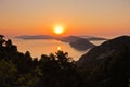 Aerial sunrise behind Alonisos island from the top of a hill in Skopelos Royalty Free Stock Photo