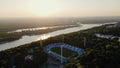 AERIAL: Sunrise over the Dnipro River and Dynamo Kyiv Lobanovskyi Stadium, Kyiv, Ukraine. Drone footage of Kyiv city at