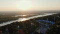 AERIAL: Sunrise over the Dnipro River and Dynamo Kyiv Lobanovskyi Stadium, Kyiv, Ukraine. Drone footage of Kyiv city at