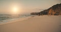 Aerial sunrise sand beach at ocean wavy bay. Nobody nature seascape with sandy sea coast and rocks