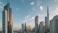 Aerial sunrise view of Dubai Downtown skyline with many towers night to day timelapse. Royalty Free Stock Photo