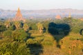 Aerial sunrise view flying over the temple and pagoda field at Bagan, Myanmar as seen from a hot air balloon flight