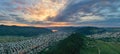 Aerial sunset and green mountain city Royalty Free Stock Photo