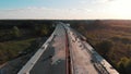 Aerial, sunset over the road bridge in development, Warsaw