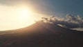 Aerial sunset over volcano erupt. Silhouette of mount. Countryside nobody nature landscape