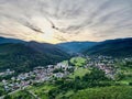 Aerial Sunset Panorama of Buhl and Lautenbach: Calm Summer in Florival Valley, Alsace - Golden Meadows, Forested Hills &