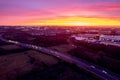 Aerial sunset scene with view on a highway and town residential and commercial area. Galway city, Ireland. Rich saturated warm and Royalty Free Stock Photo