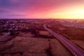 Aerial sunset scene with view on a highway and town residential and commercial area. Galway city, Ireland. Rich saturated warm and Royalty Free Stock Photo