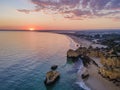 Aerial sunset  view of the beautiful Praia dos Tres Irmaos Tree Brothers beach in Alvor, famous tourist destination in Algarve Royalty Free Stock Photo