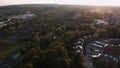 Aerial sunset view of a small town in Surrey, England during Isolation of Covid-19 in summer