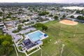 Aerial of a swimming pool and baseball field inside Norman and Jean Reach Park on Palm Springs North, Miami-Dade County, Florida. Royalty Free Stock Photo